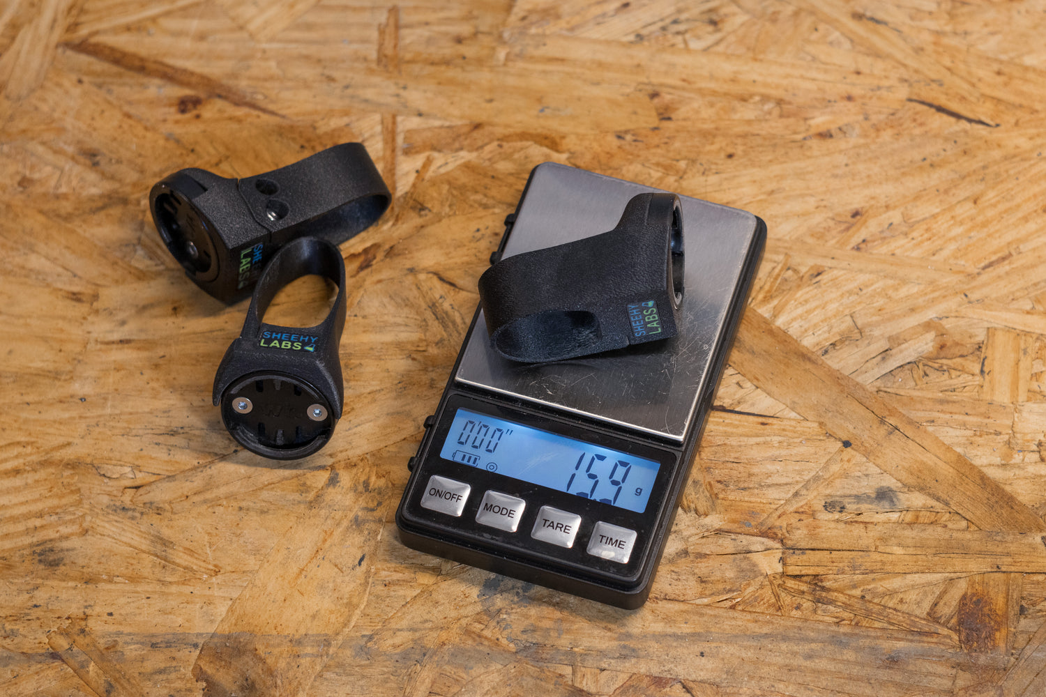 Standard quarter turn radar mount on a scale showing it is 15.9 grams